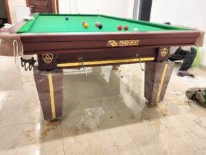 Rasson Magnum Golden Edition 5x10 Steel Cushion Snooker Table in Mehroon Matt Colour installed by A Plus Snooker Table