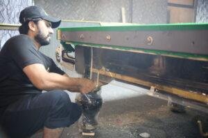 Professional snooker table installation process showing slate leveling and setup