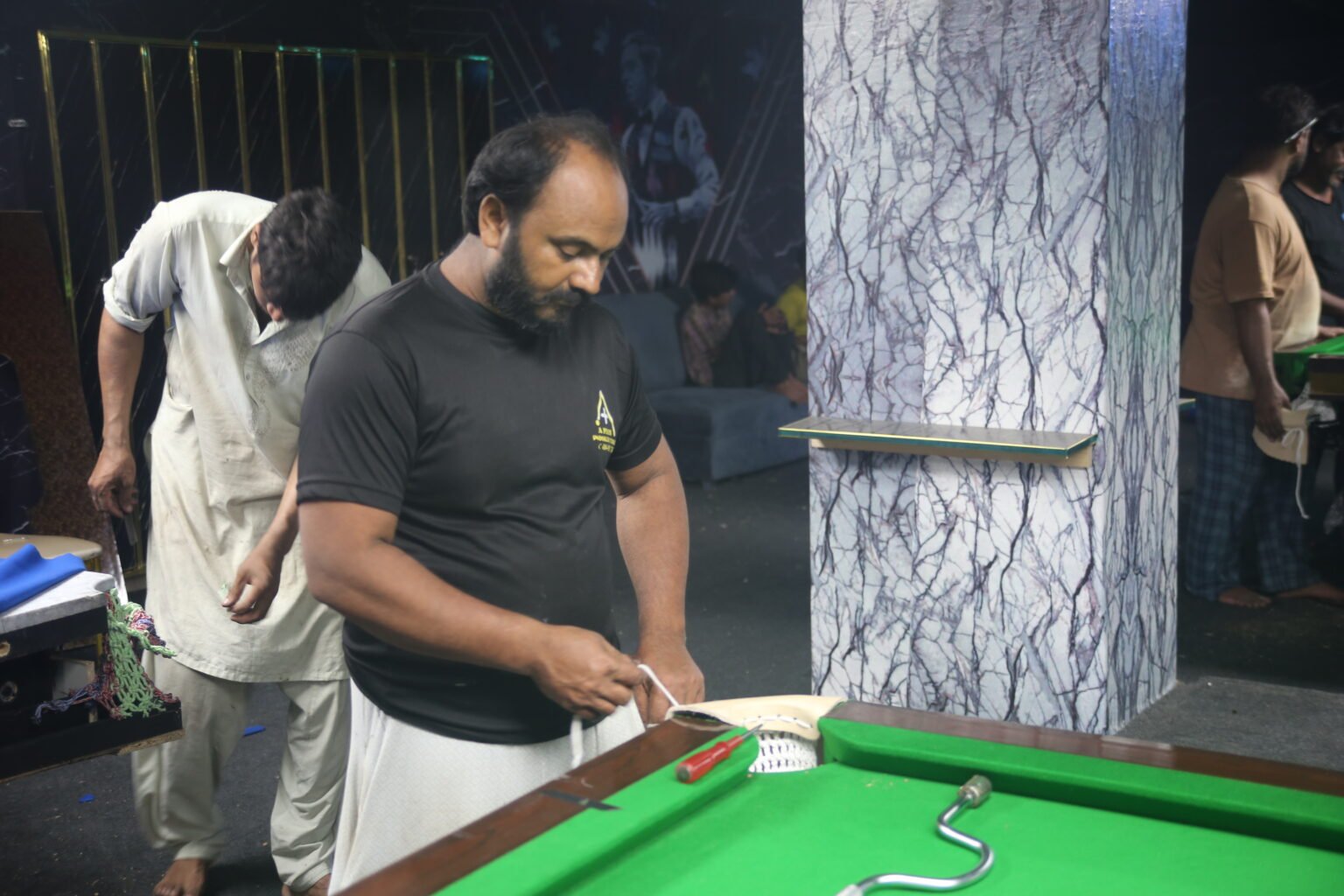 Snooker table fitter, professional snooker installation, slate leveling, cushion fitting, table maintenance, snooker cloth installation, billiards setup, precision snooker installation